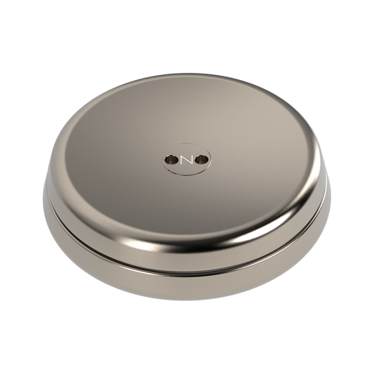 The ONO Slider Titanium is a round, metallic, titanium-colored object with a smooth, slightly domed surface and two small center holes—ideal as a minimalist fidget toy or as an accessory for your ONO Slider.