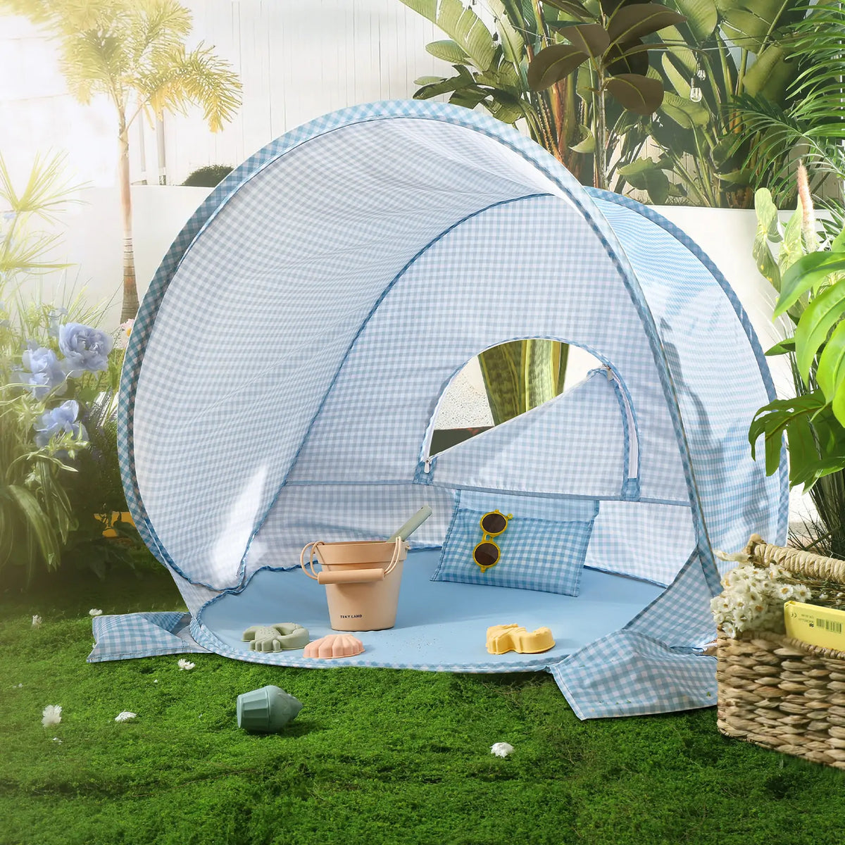 Blue and white gingham Kids Beach Tent & Sand Toy Set featuring a matching floor mat, a small bucket, toy molds, and sunglasses.