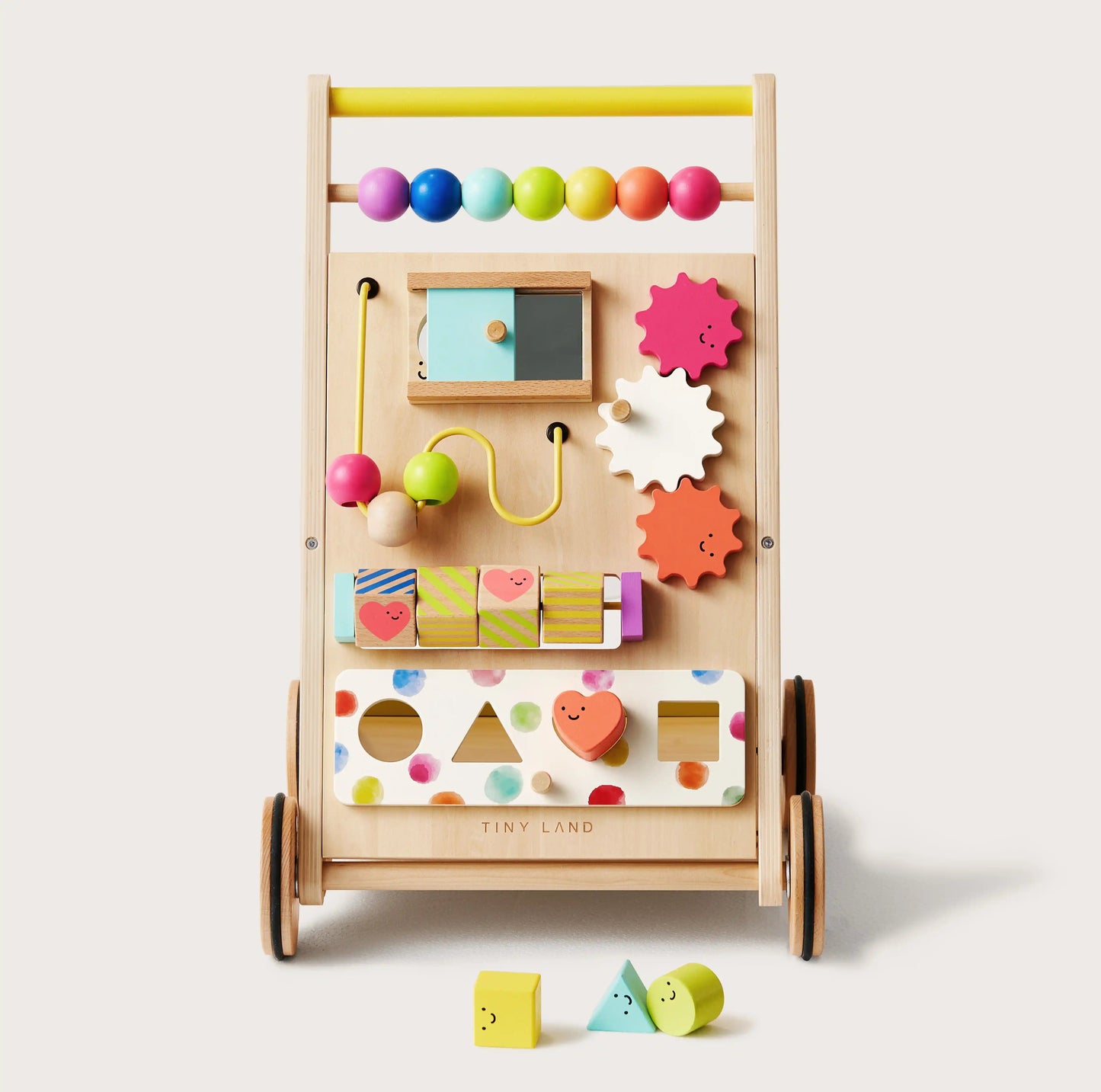 The Tiny Land® Premium Natural Wooden Activity Walker for toddlers includes colorful beads, gears, sliding blocks, a bead maze, and shape-sorting holes with matching blocks placed in front.