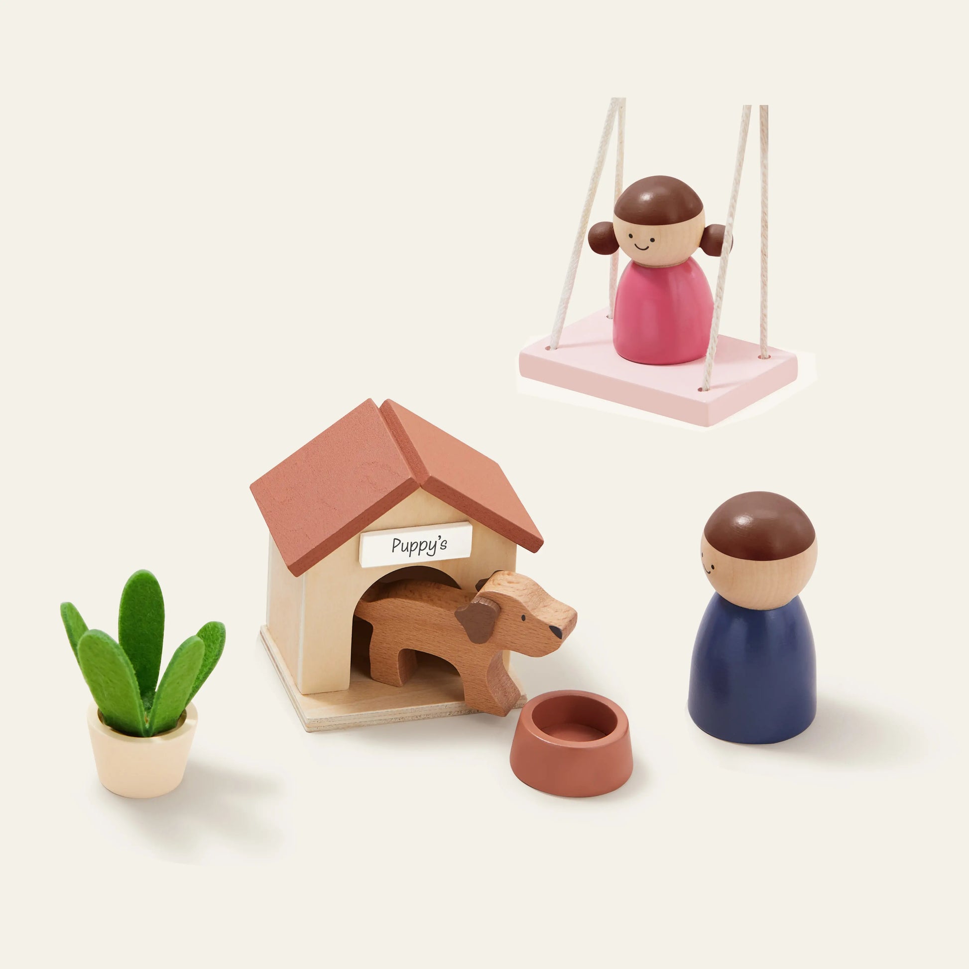 The Tiny Land® Sweetwood Edge Dollhouse set includes a girl on a swing, a dog in a doghouse with bowl, a child figurine, and a potted plant, all displayed on a plain cream background—perfect for contemporary play.
