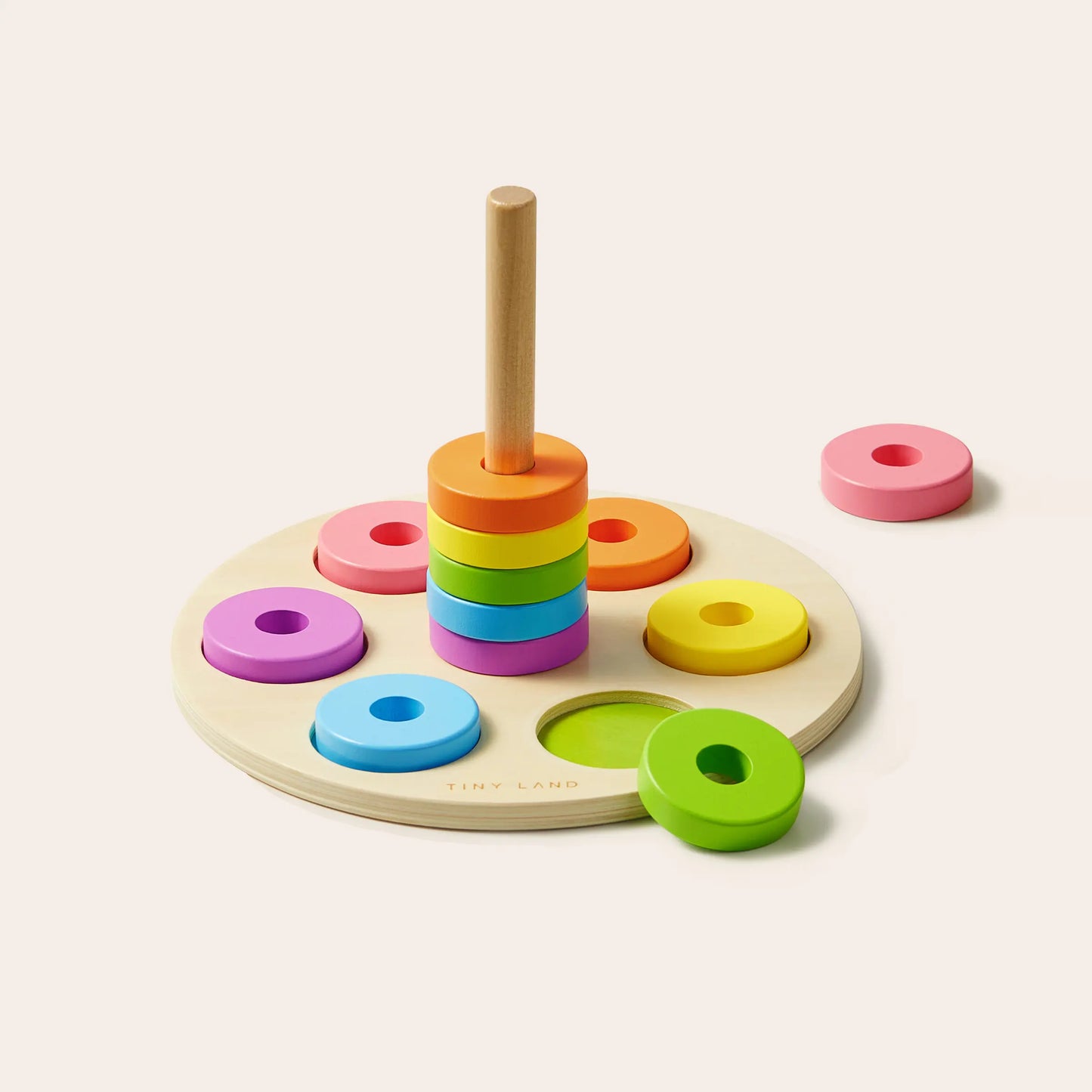 Tiny Land® Montessori Toys for Toddlers (13–15 Months) features a wooden stacking toy with colorful rings and a central rod, making it an ideal educational addition to any Montessori learning box.