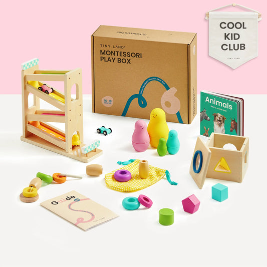 The Tiny Land® Montessori Toys for Toddlers (16–18 Months) set includes wooden toys, stacking dolls, a shape sorter, beads, a ramp toy with balls, an animal book, and a yellow pouch—perfect educational fun! COOL KID CLUB banner in the background.