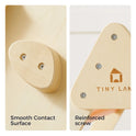 Two close-up views of the 7-in-1 Montessori Climbing Set with Play Pad showing a smooth, rounded attachment and a triangular corner connector secured with reinforced metal screws on the Pikler triangle.