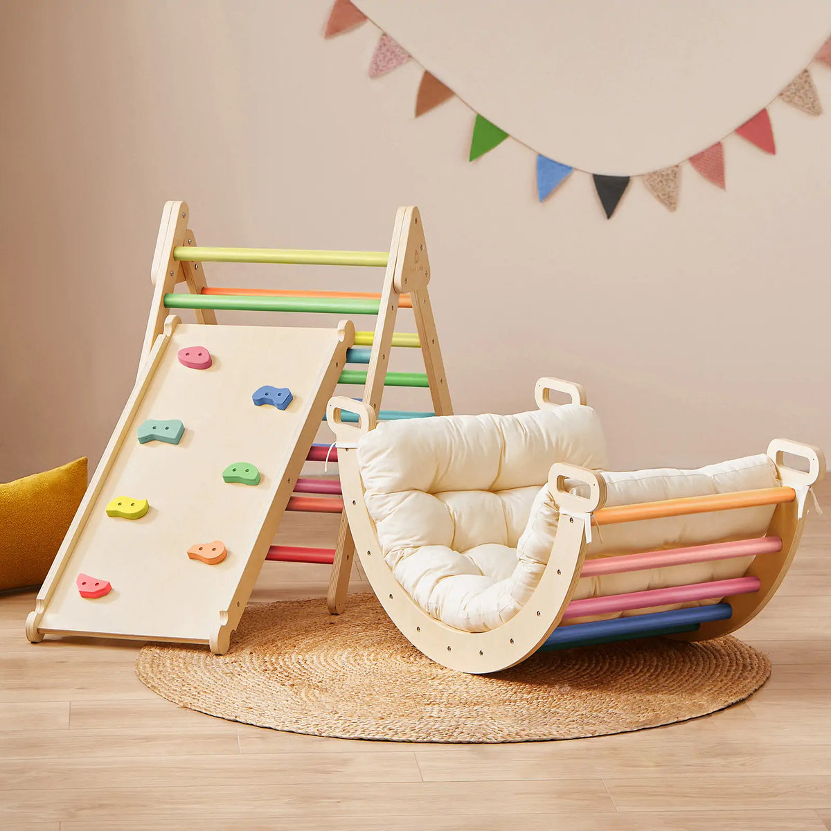 The 7-in-1 Montessori Climbing Set with Play Pad – Rainbow includes a wooden Pikler triangle with a slide and a cushioned rocking seat featuring colorful bars and a padded play cushion.