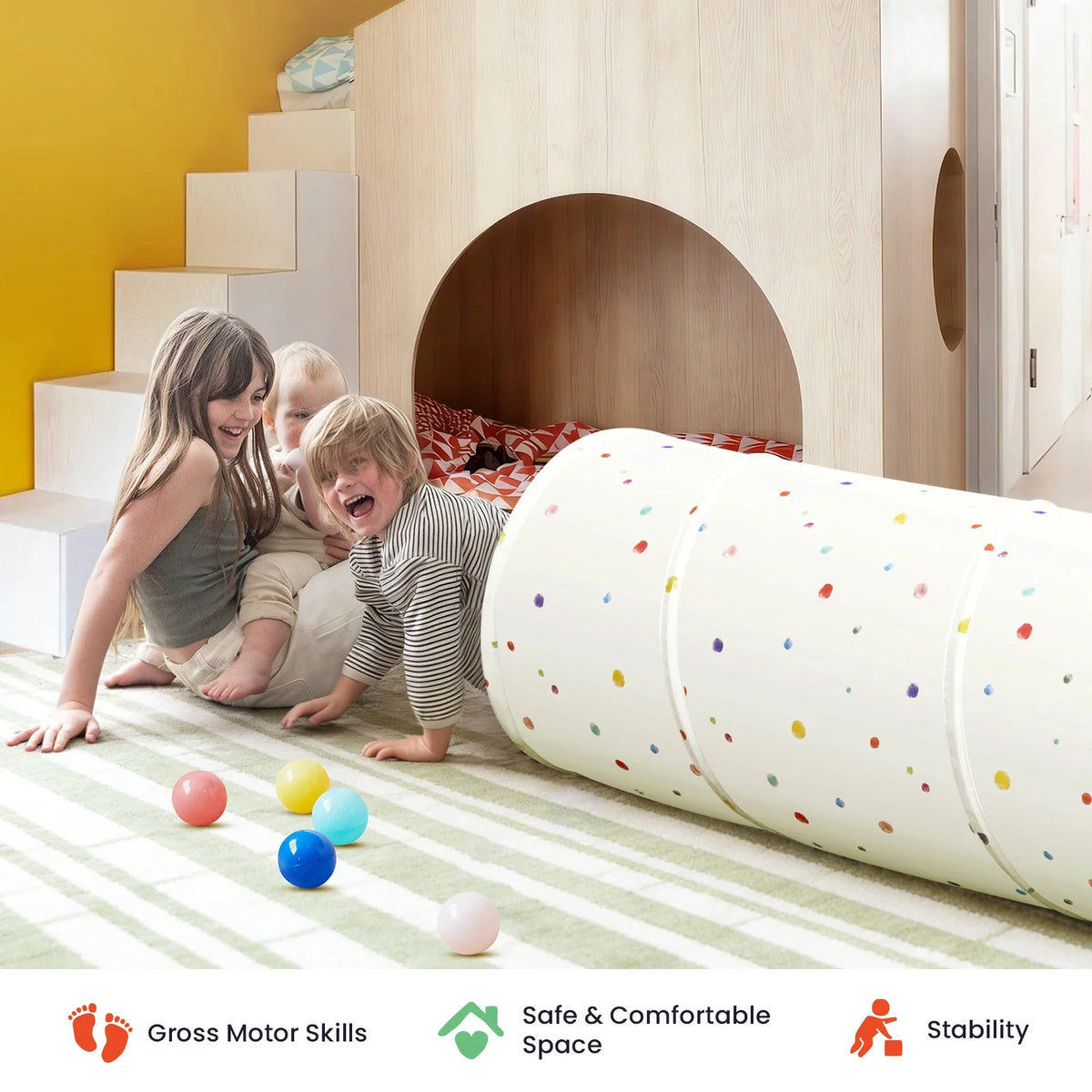 Three children playing with a white, polka-dot Adventure Crawl Tunnel (68″) on a carpeted floor.
