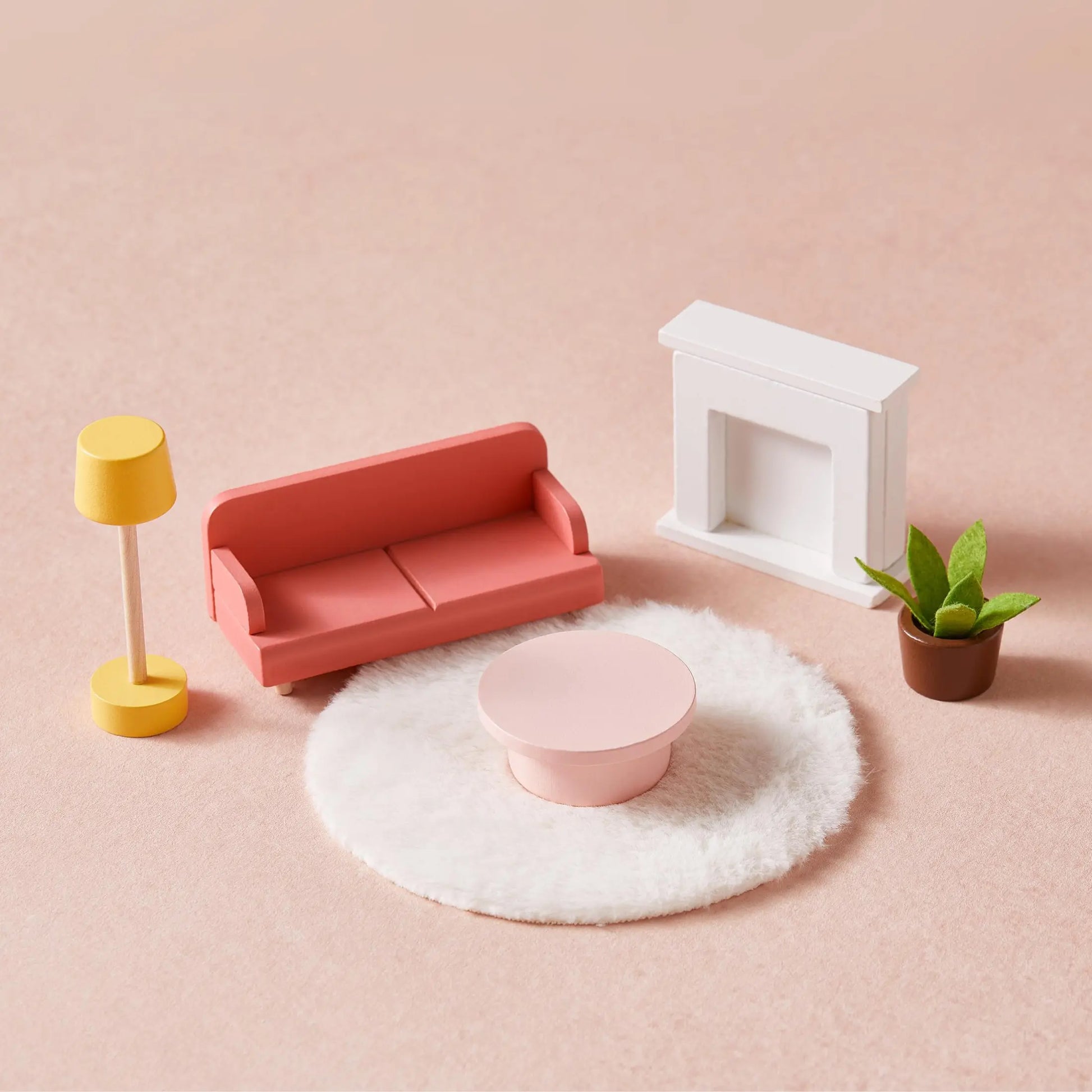 The Tiny Land® Sweetwood Love Dollhouse without Dolls includes a pink sofa, round coffee table, and yellow floor lamp—ideal for imaginative play, all beautifully arranged on a light pink surface.