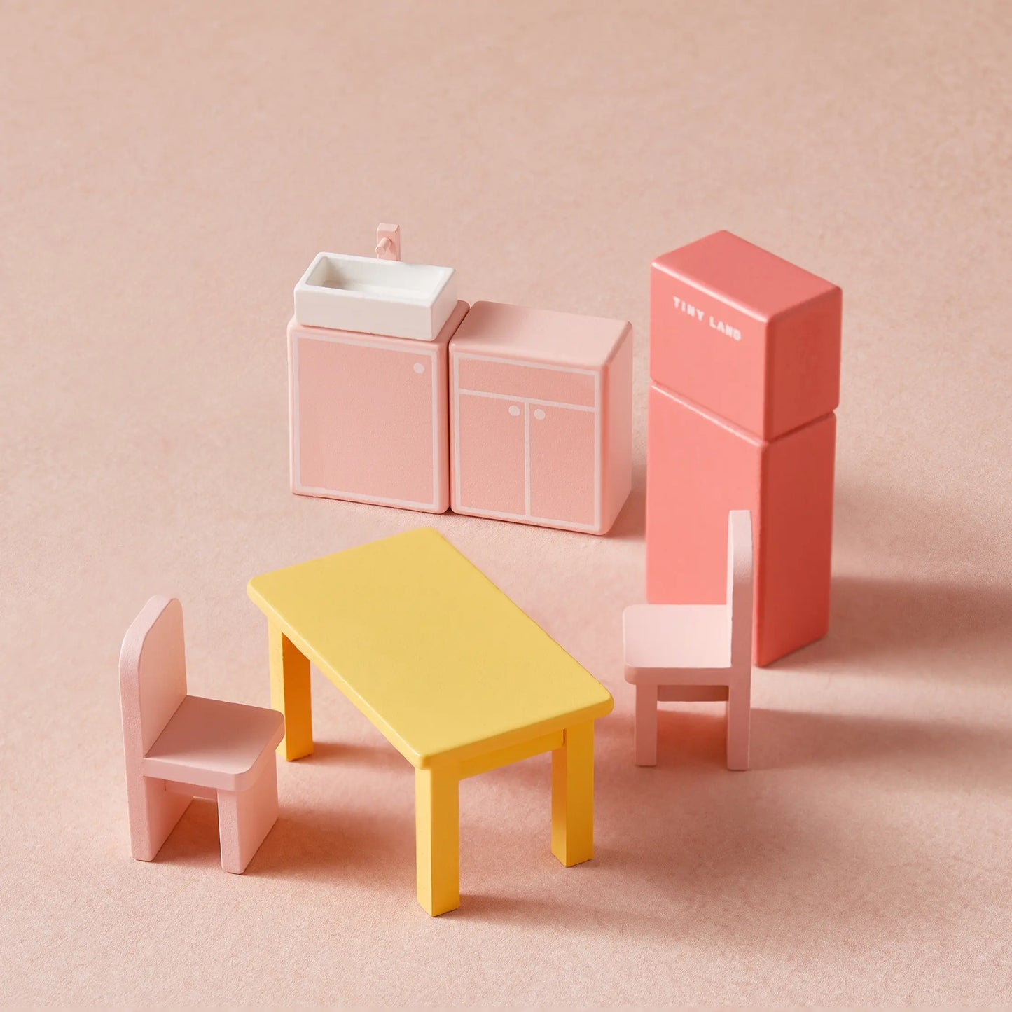 Mini kitchen furniture set with two pink chairs, yellow table, pink sink/cabinet, and pink fridge—perfect for the Tiny Land® Sweetwood Love Dollhouse without Dolls and imaginative play.