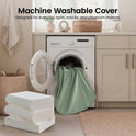 A light green fabric cover being pulled from a washing machine for the GentleSnug Flip-Open Kids Sofa & Nap Mat, with a stack of white foam cushions nearby; text reads, Machine Washable Cover: Designed for everyday spills, snacks, and messes.