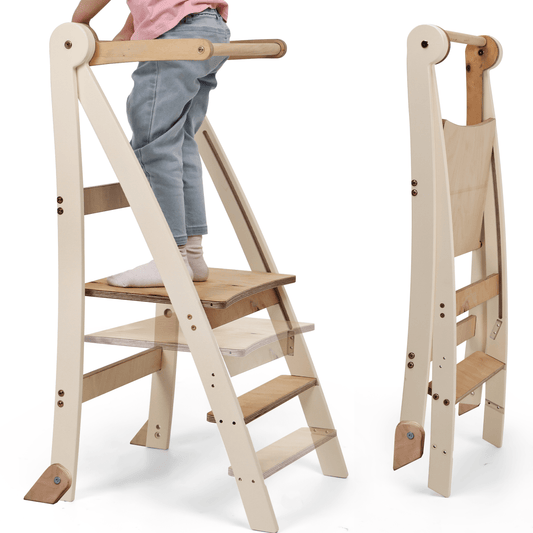 A child stands on the Adjustable Montessori Tower - Kids Step Stool, a natural wood high chair featuring steps and a safety bar, while a folded version of the tower is displayed beside it.