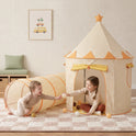 A young child sits inside a tan gingham Starry Indoor Play Tent for Toddlers and reaches out to play with another child who is crawling through an attached tunnel.
