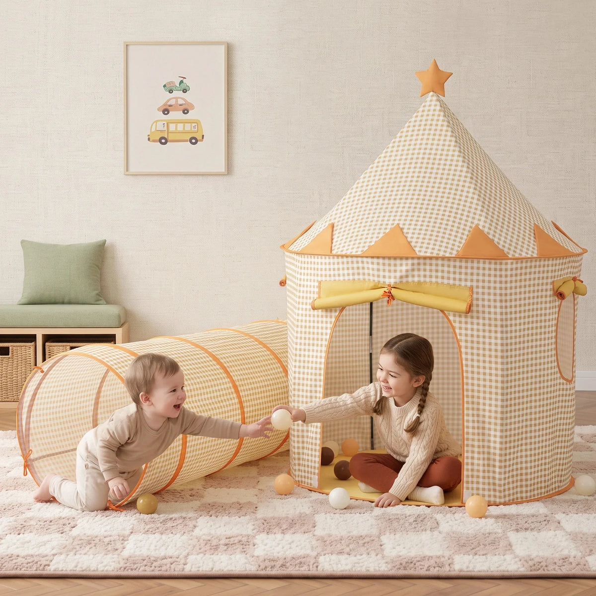 A young child sits inside a tan gingham Starry Indoor Play Tent for Toddlers and reaches out to play with another child who is crawling through an attached tunnel.