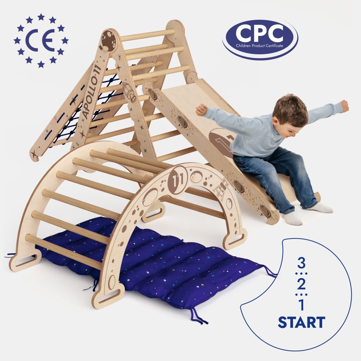 A young boy slides down the Apollo 5in1 Climbing Set—featuring a Pikler triangle, net, arch, slide board, and cushion for little astronauts—landing on a blue mat. CE and CPC logos appear with a 3...2...1 START countdown graphic.