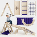 A boy plays on the Apollo 5in1 Climbing Set—a modular Pikler triangle, net, arch, slide board, and cushion for little astronauts—featuring space-themed designs, purple star-patterned mats, and a toy rocket.