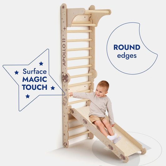 A young child slides down the Apollo Swedish Wall / Climbing ladder for Little Astronauts + Moon swing Set + Slide Board, featuring surface MAGIC TOUCH, ROUND edges, and playful moon and star designs.
