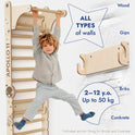 A young child hangs from the Apollo Swedish Wall / Climbing ladder for Little Astronauts + Moon Swing Set + Slide Board, a wooden indoor playset for ages 2–12 (up to 50 kg), with anchor fixings—perfect for any home sports corner.