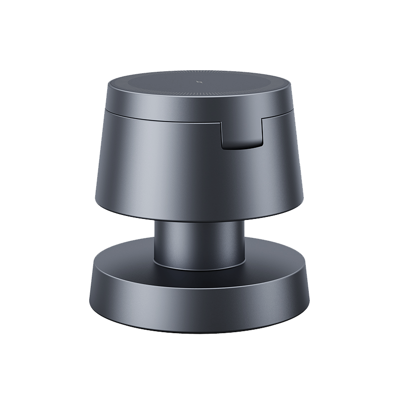 The 4-in-1 Wireless Charging Station, featuring a sleek dark gray two-tier design with a notch on the upper level and a wide base, offers convenient charging for Apple devices, shown against a plain white background.