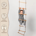 A young child in gray clothing climbs the Climbing rope ladder for kids 3-9 y.o., developing muscle strength and growing in self-confidence with each step. To the left, icons highlight CREATIVITY, MUSCLE DEVELOPMENT, and SELF-CONFIDENCE. The light, plain background draws focus to the essential role of active play in healthy child development.