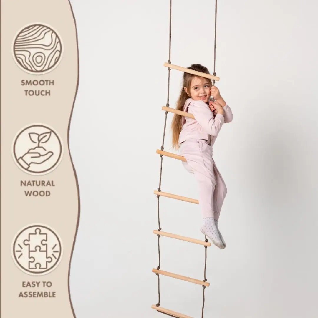 A young girl in light pajamas climbs the Climbing Rope Ladder for kids 3-9 y.o., an activity that supports child development and muscle strengthening. Beside her, icons highlight features: smooth touch, natural wood, easy to assemble. The background is plain white.