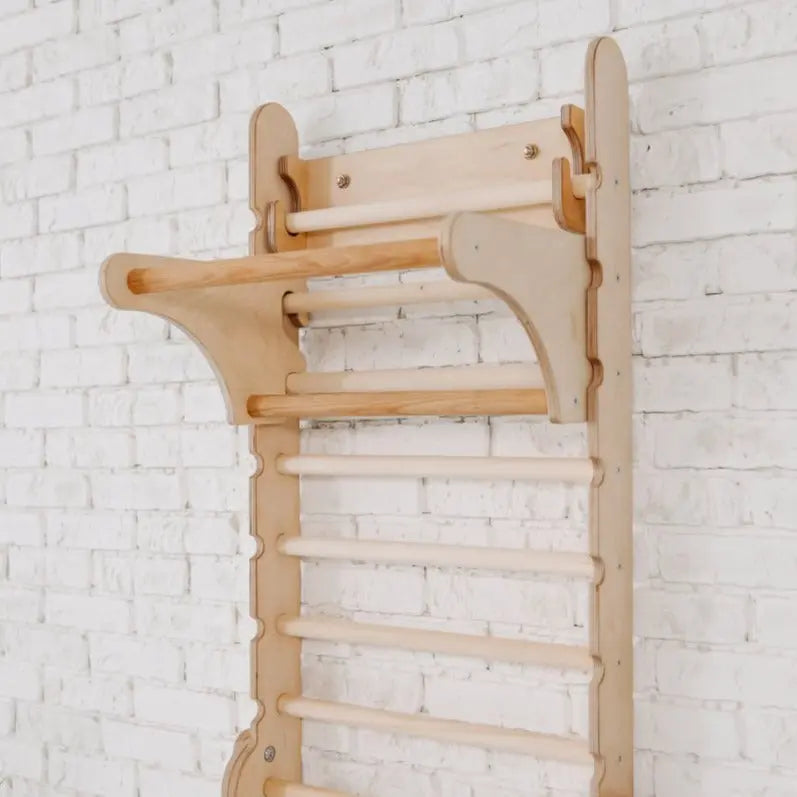 Upgrade your workout setup with the Gym Addition to the Climbing Ladders—this wooden wall-mounted gym ladder features horizontal bars and an upper pull-up bar, securely attached to a white brick wall for versatile indoor use. Enhance functionality and fun by pairing it with a triangle ladder or other Swedish ladder add-ons.