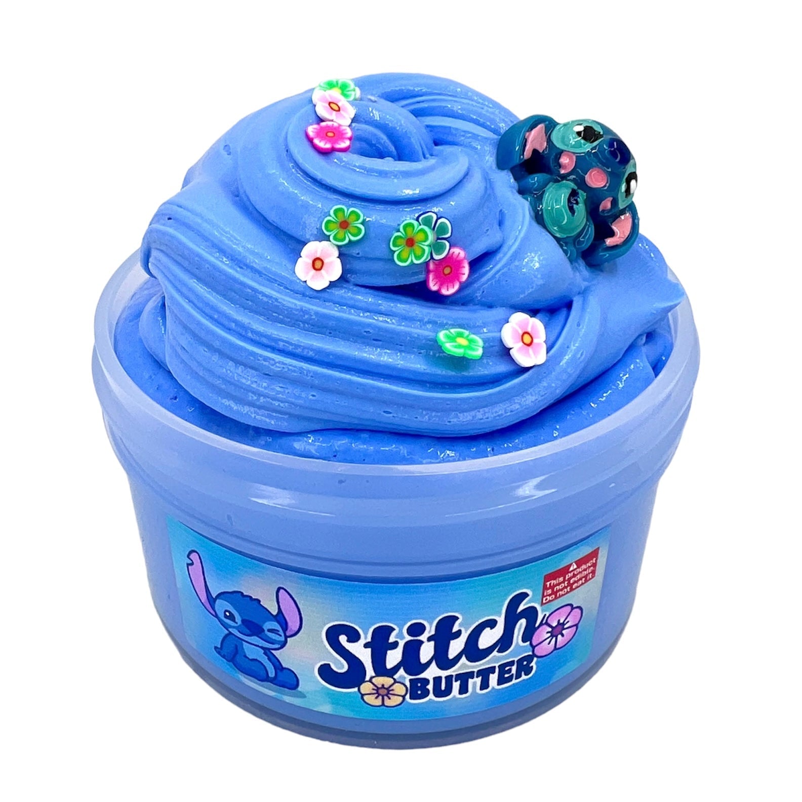 Stitch Butter Slime 7 Oz features light blue butter slime with a Blue Hawaiian scent, colorful flower sprinkles, and a Stitch charm. The tub displays an image of Stitch on the front.