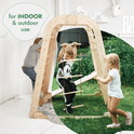 Three young children play on the Indoor Playground for Children – 7in1 Playground + Swings Set + Slide Board + Art Set. The left side shows indoor use, while the right side is outdoors, showcasing its versatility for indoor and outdoor fun.