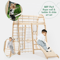 The Indoor Playground for Children - 7in1 Playground features a Montessori climbing structure with rope wall, ladder, gym rings, slide, swings set, and art set. Two boys play—one climbs the rope while another slides down.