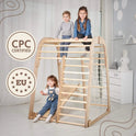 Three children play on the Indoor Wooden Playground for Children - 6in1 Playground + Swings Set + Slide Board in a bright, airy room decorated with toys. Two kids are at the top of the wooden Montessori-inspired playset, while one climbs underneath. Text in the image displays “CPC Certified” and “EU,” each highlighted in star-shaped round badges.