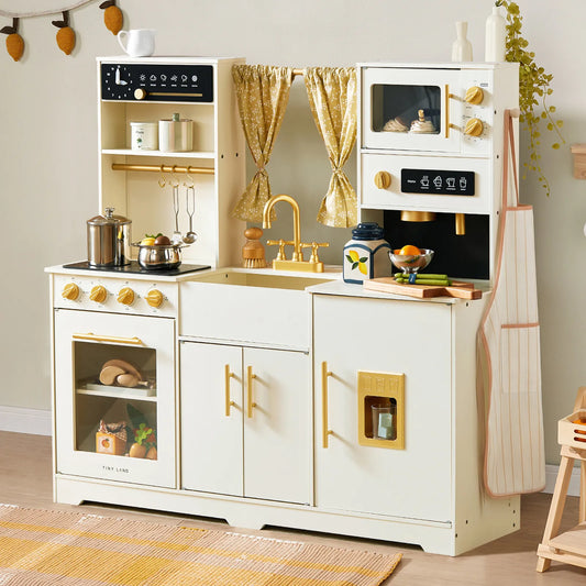 Iconic Wooden Play Kitchen – Cream, a cream-colored wooden play kitchen with a stove, sink, oven, microwave, gold-toned hardware, interactive features, and miniature kitchen accessories for pretend cooking.