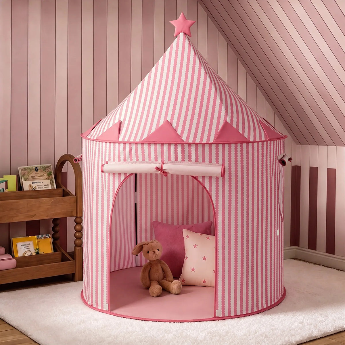 Pink and white striped conical Starry Indoor Play Tent for Toddlers with a star on the peak and a stuffed rabbit inside.