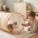 A young child plays with a kitten inside a 68″ Adventure Crawl Tunnel that features a long, tan and white checkered pattern.