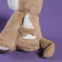 Alfie the Wolf Plush + Book is a tan plush wolf toy sitting with a white cloud patch on its back, designed as a calming toy for children.