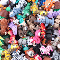 A large pile of colorful, articulated 3D-printed Mini Fidget Creatures – Surprise Pack in various animal designs.