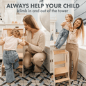 A woman helps a young child climb the Stable Montessori Learning Tower: Wooden Growing Chair - Ivory in the kitchen and lifts her down as they smile. Text reads: ALWAYS HELP YOUR CHILD climb in and out of the tower.