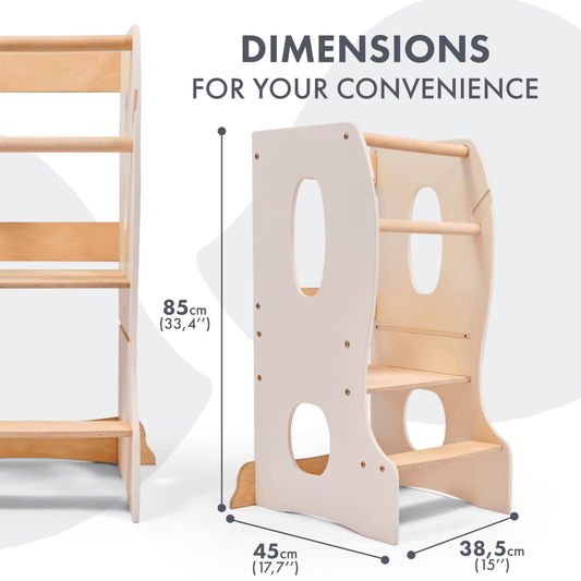 The Stable Montessori Learning Tower: Wooden Growing Chair - Ivory is made from natural wood, has side handles, an adjustable platform, two steps, and measures 85 cm tall, 45 cm wide, and 38.5 cm deep.