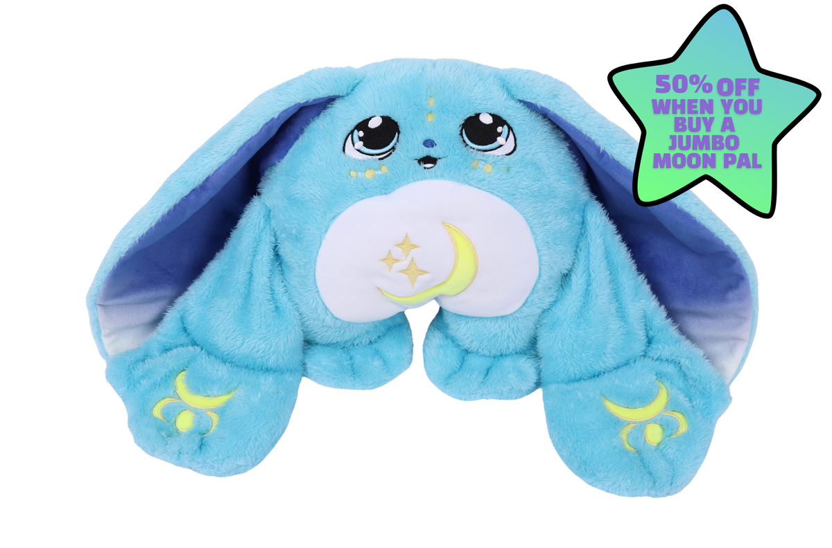 A blue Bo Jr. Moon Pal – 2.5 lb Kids Weighted Plush with long ears, large eyes, and a crescent moon and stars on its belly, next to a star-shaped sign advertising 50% off a jumbo moon pal.