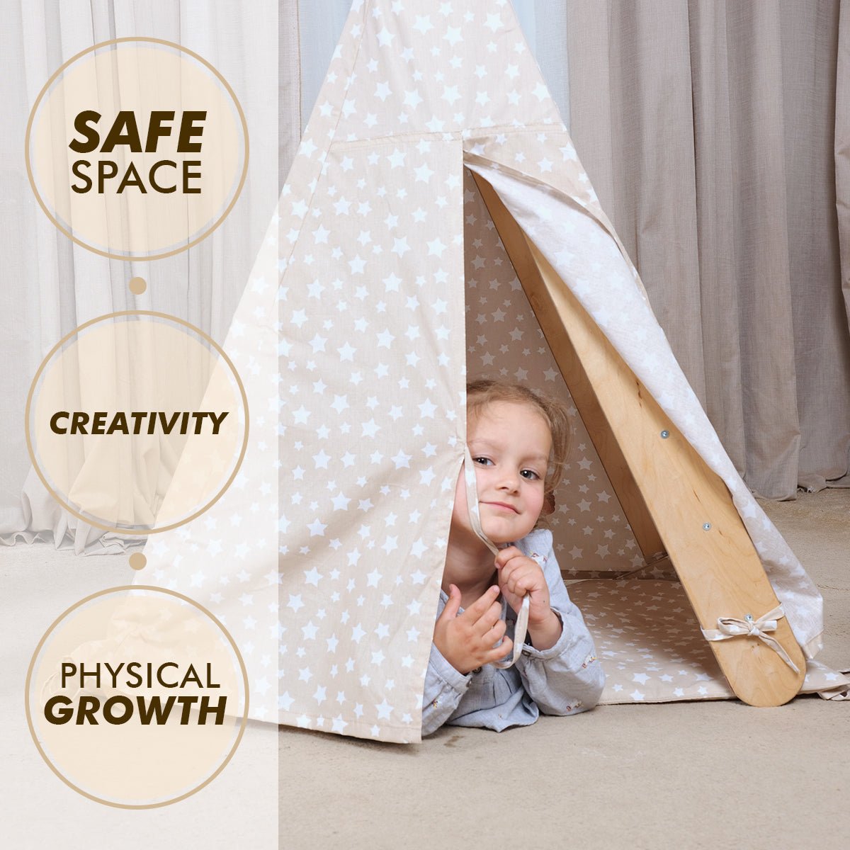 A young child peeks out from the Play Tent Cover with Mat for Climbing Triangle Ladder, cozily set up beside a Montessori triangle ladder. Nearby text highlights: SAFE SPACE, CREATIVITY, and PHYSICAL GROWTH. Soft neutral curtains and carpeting provide a calming backdrop.