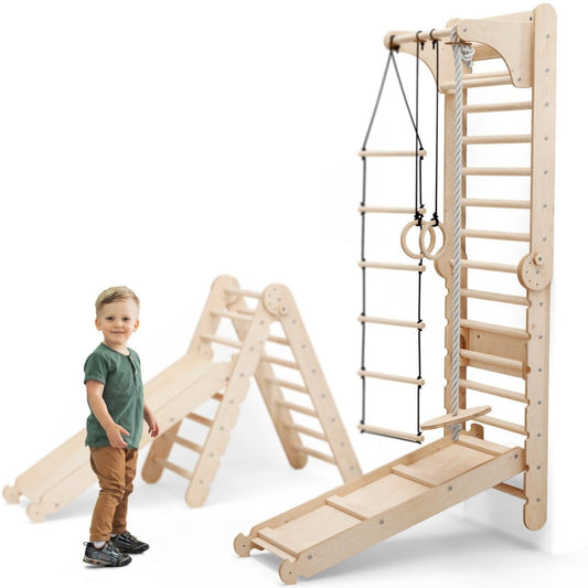 A young child stands beside the Swedish Ladder Set + Swing Gym 3in1, which features a slide board and triangle ladder—perfect for active indoor play with climbing ladders, gymnastic rings, rope ladder, swing, and a climbing wall.