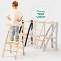 A young child stands on a Toddler Tower: Foldable Step Stool for Toddlers - Gray, with three stylish color options shown side by side. A speech bubble above the towers reads Choose YOUR COLOR. This foldable toddler step stool blends safety and style—perfect for supporting your little one’s everyday adventures.