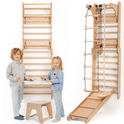 Two smiling children stand near the Wooden Swedish Wall, a play gym featuring a climbing ladder, swing set, slide board, and art add-on with table and stool for drawing—perfect for active play and creativity.