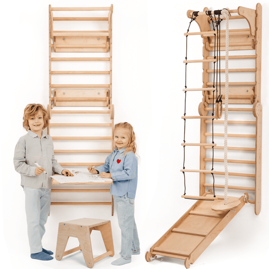 Two smiling children stand near the Wooden Swedish Wall, a play gym featuring a climbing ladder, swing set, slide board, and art add-on with table and stool for drawing—perfect for active play and creativity.