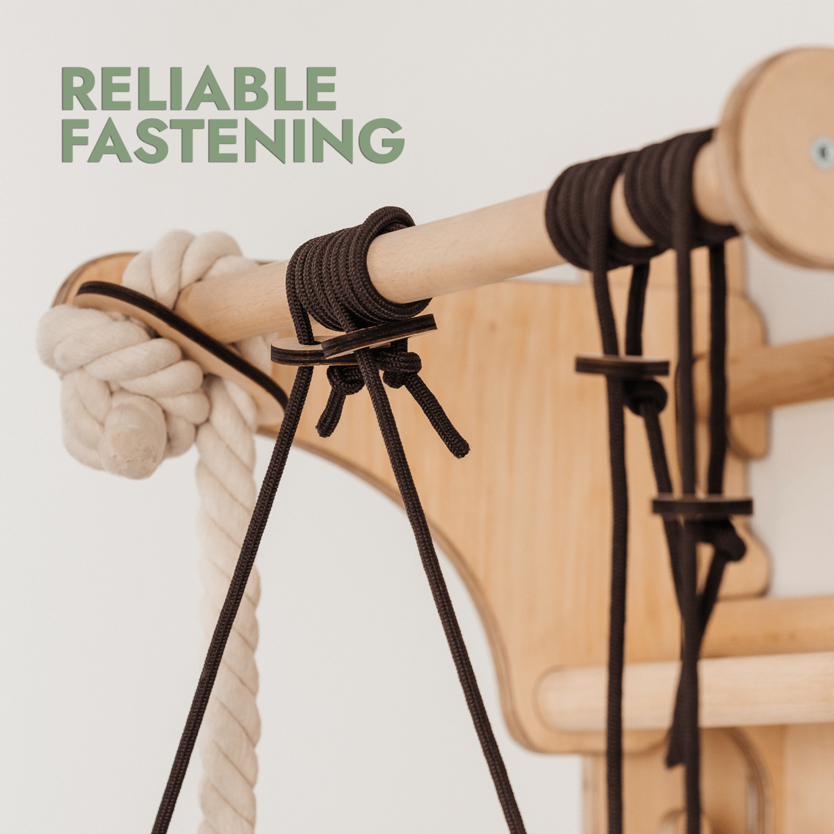 Close-up of ropes and cords securely tied to the Wooden Swedish Wall / Climbing Ladder for Children + Swing Set + Slide Board + Art Add-on, with RELIABLE FASTENING in green in the upper left corner.